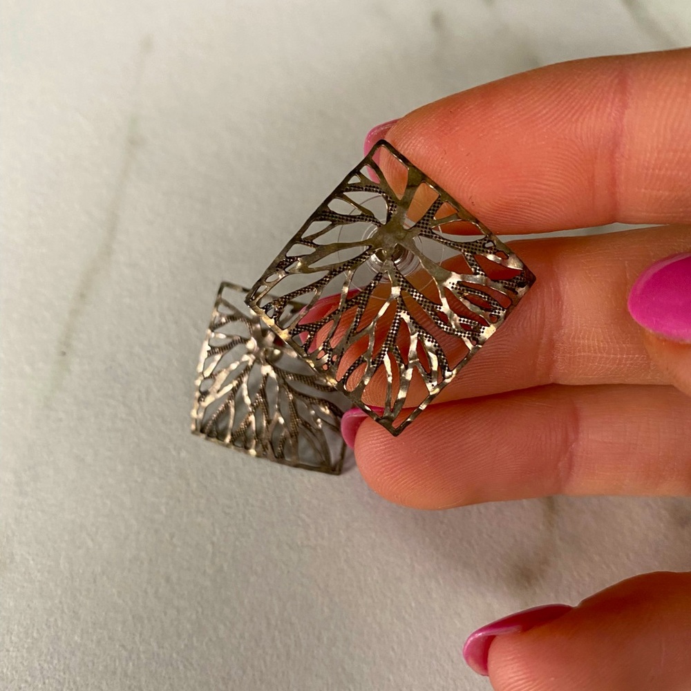 Silver textured square earrings.